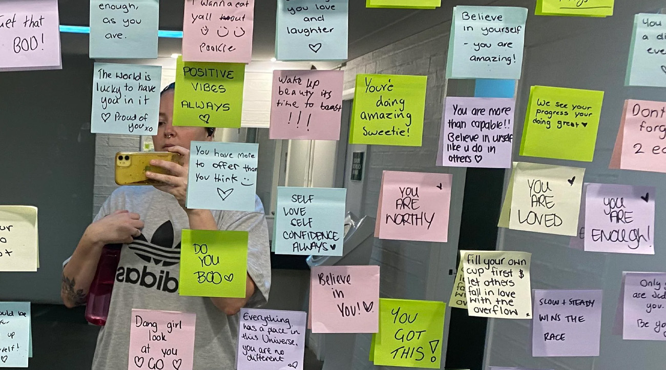 A Simple Act of Kindness Turned This Gym Locker Room Into a Wall of Positivity